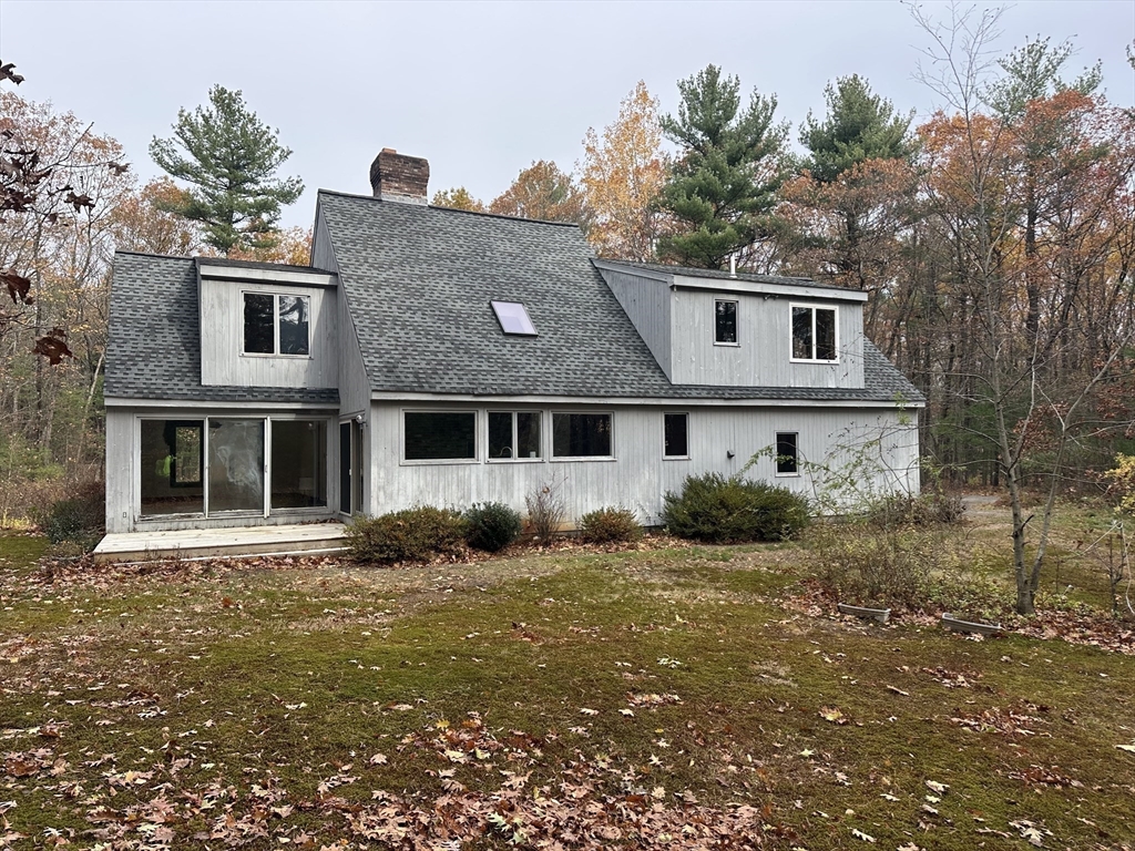 332 Old Littleton Road Harvard, MA 01451 - Photo 6 of 31 a house that has a tree in front of it