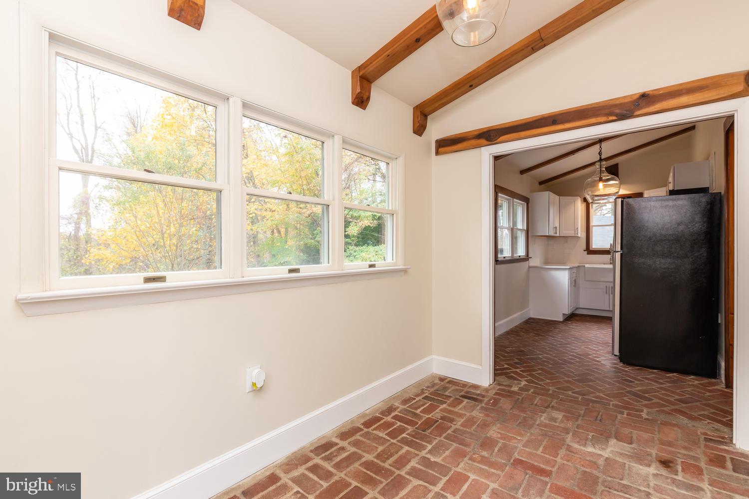 154 Neal Road Coatesville, PA 19320 - Photo 36 of 38 Breakfast room with exposed beams and brick floor.