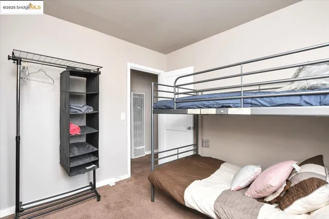 a bedroom with a bed and walk in closet