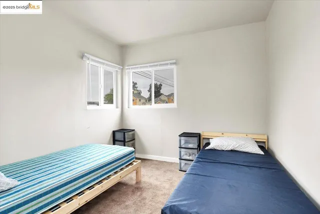 a bedroom with bed and window