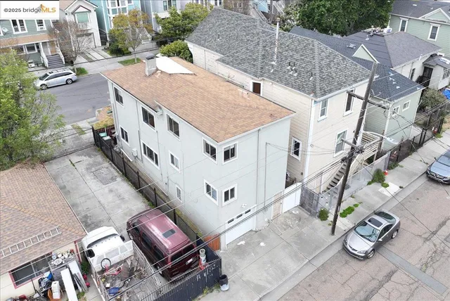 an aerial view of a house with outdoor space