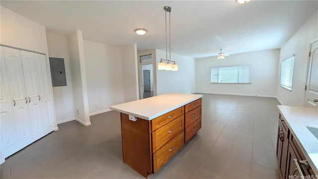 a kitchen with kitchen island and a wooden floor