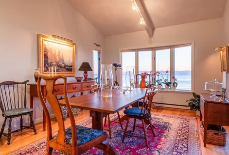 a view of a dining room with furniture window and outside view