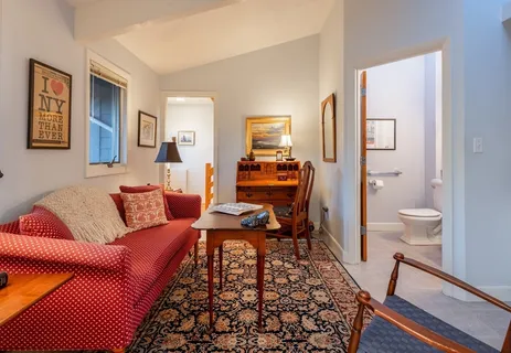 a living room with furniture and a rug