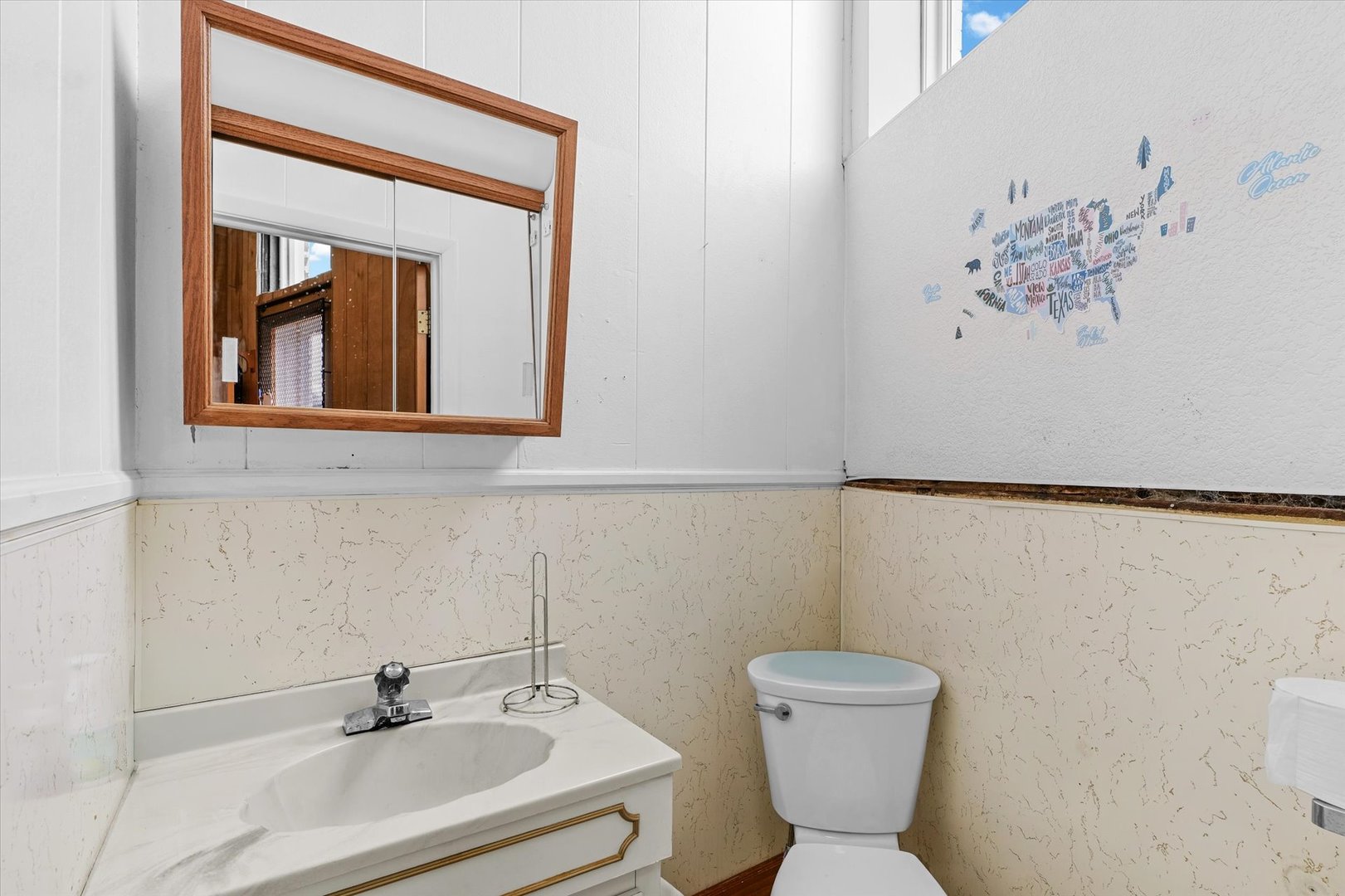 101 East Sangamon Avenue Rantoul, IL 61866 - Photo 19 of 26 a bathroom with a toilet sink and mirror