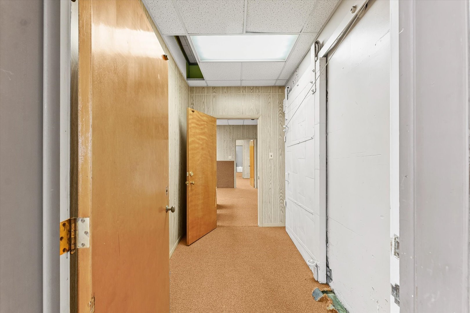 101 East Sangamon Avenue Rantoul, IL 61866 - Photo 23 of 26 a view of a hallway with a wooden door