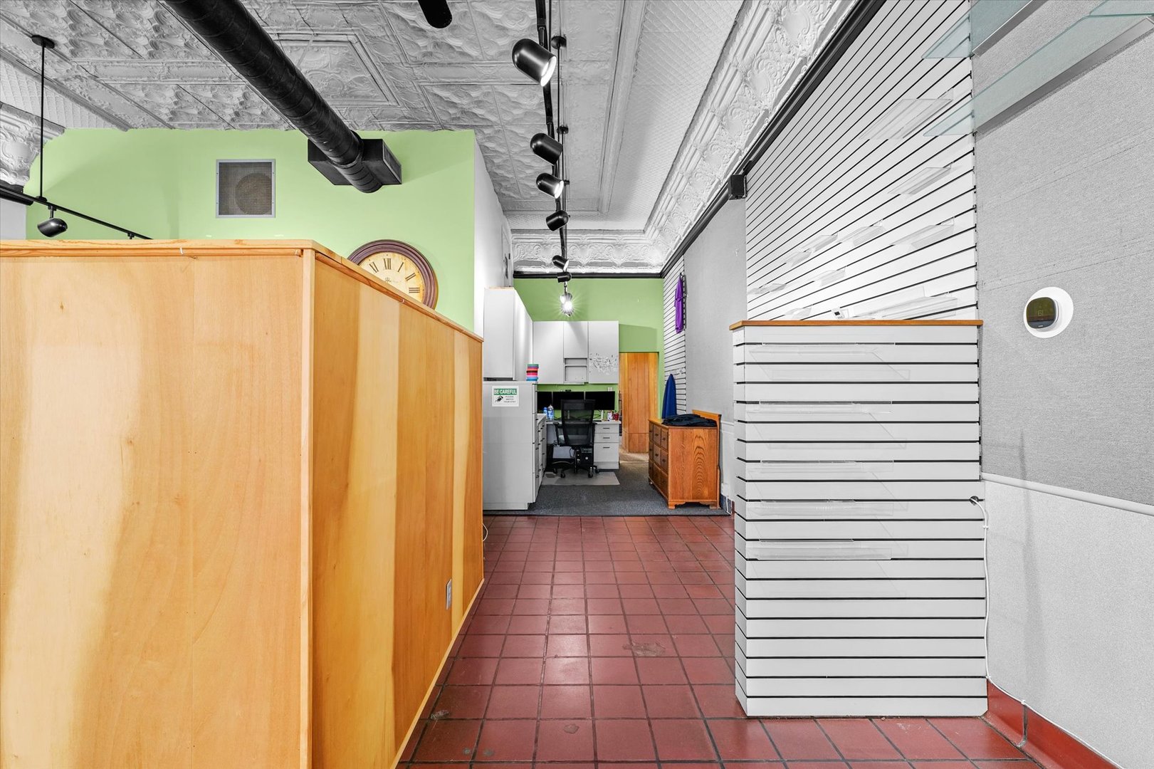 101 East Sangamon Avenue Rantoul, IL 61866 - Photo 8 of 26 a view of a house with a door and wooden walls