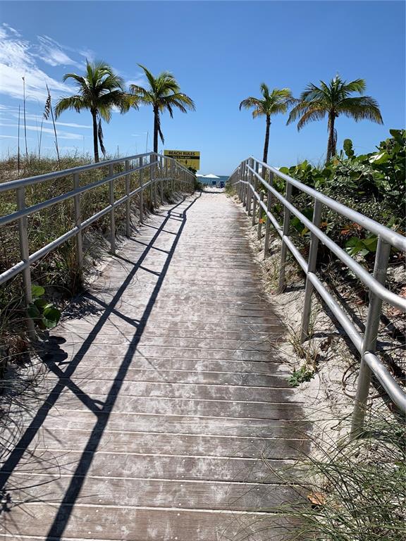 273 Rex Place, Unit G Madeira Beach, FL 33708 - Photo 13 of 42 a view of a backyard