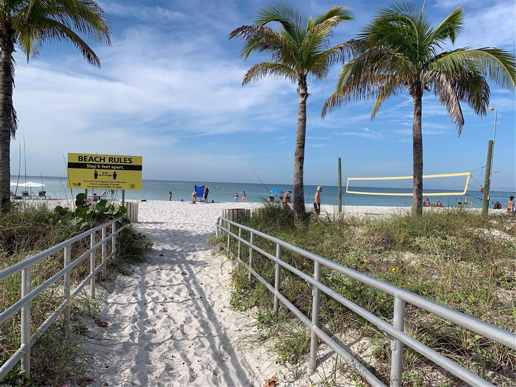 273 Rex Place, Unit G Madeira Beach, FL 33708 - Photo 15 of 42 a balcony with view of palm trees