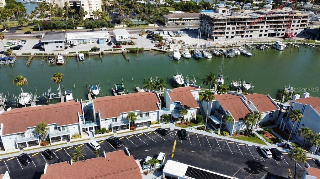 273 Rex Place, Unit G Madeira Beach, FL 33708 - Photo 3 of 42 an aerial view of a house with outdoor space and lake view