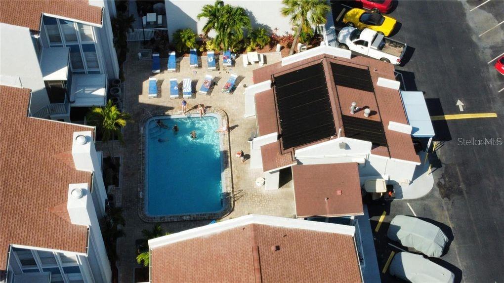 273 Rex Place, Unit G Madeira Beach, FL 33708 - Photo 5 of 42 an aerial view of a house with a yard