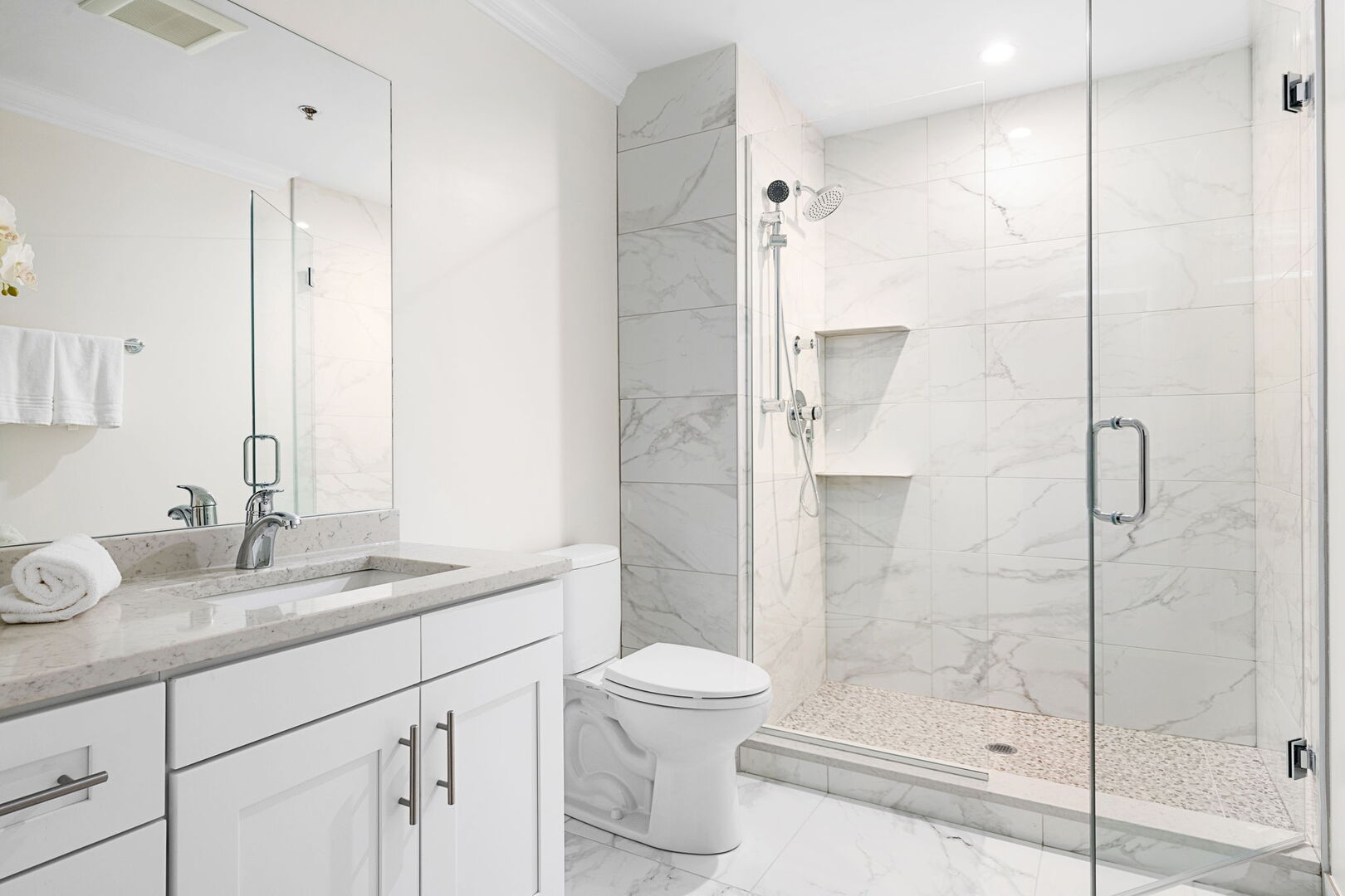 1609 North Rutherford Avenue, Unit 106 Chicago, IL 60707 - Photo 4 of 5 a bathroom with a granite countertop sink a toilet and shower