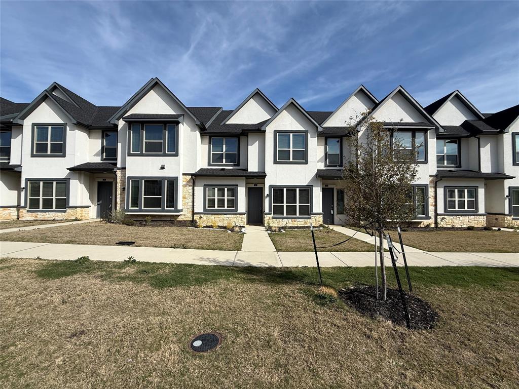 346 Buck Ridge Drive Frisco, TX 75068 - Photo 1 of 19 View of front of property featuring stone siding, stucco siding, and a front yard