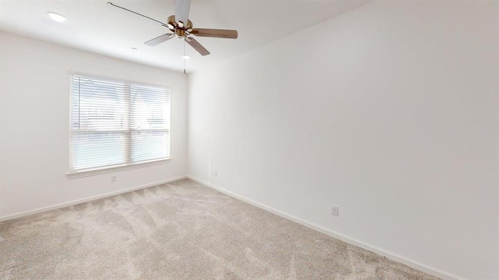346 Buck Ridge Drive Frisco, TX 75068 - Photo 13 of 19 Spare room featuring light carpet and a ceiling fan