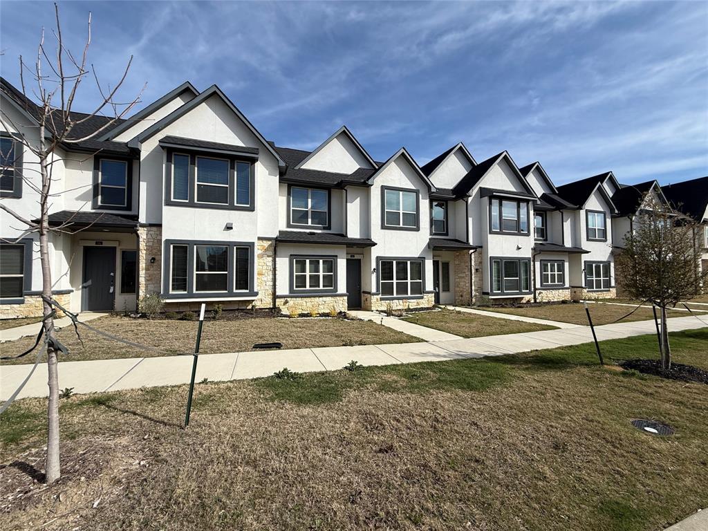 346 Buck Ridge Drive Frisco, TX 75068 - Photo 2 of 19 View of front of home featuring stucco siding, stone siding, and a residential view
