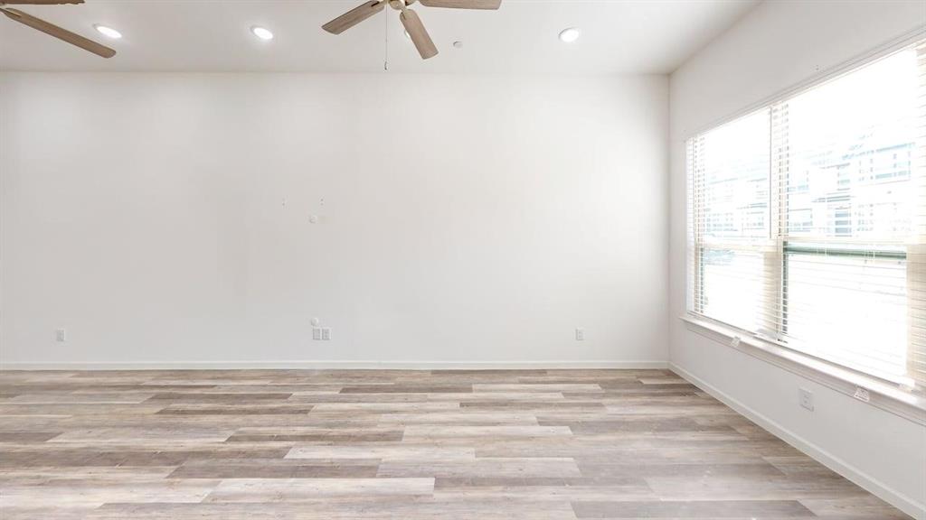 346 Buck Ridge Drive Frisco, TX 75068 - Photo 8 of 19 Unfurnished room with ceiling fan, light wood-style flooring, and recessed lighting