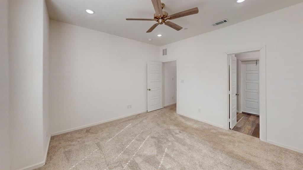 346 Buck Ridge Drive Frisco, TX 75068 - Photo 9 of 19 Unfurnished bedroom with ceiling fan, light carpet, and recessed lighting