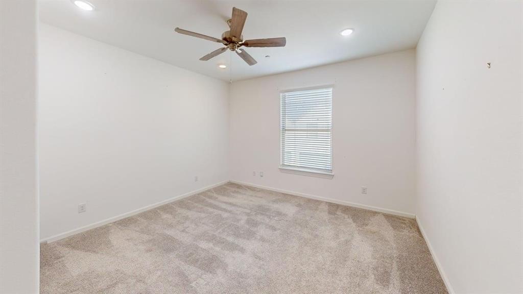 346 Buck Ridge Drive Frisco, TX 75068 - Photo 10 of 19 Spare room featuring light carpet, a ceiling fan, and recessed lighting