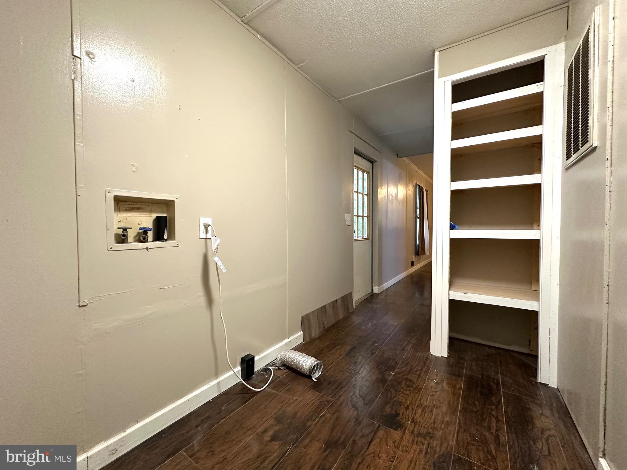 606 Dogwood Acres Road Bumpass, VA 23024 - Photo 14 of 20 a room with a wooden floor and a window