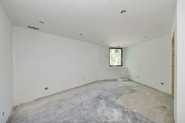 a view of a storage & utility room with two washing machine