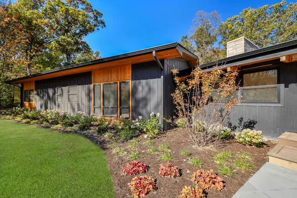 a front view of a house with garden