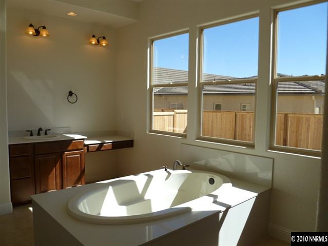 1645 Woodcrest Court Reno, NV 89523 - Photo 7 of 9 a bathroom with a sink and a window