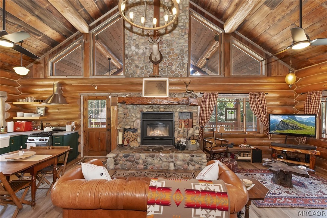 29632 Hook Creek Road Cedar Glen, CA 92321 - Photo 5 of 43 a living room with furniture a fireplace and a flat screen tv