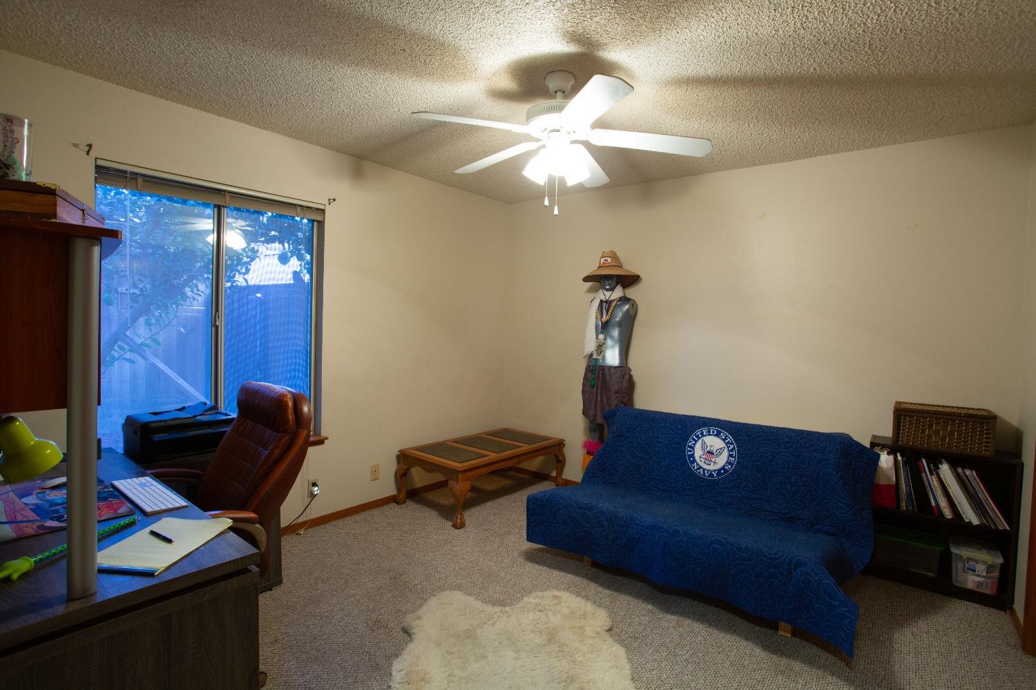 1570 Pine Drive Lemoore, CA 93245 - Photo 12 of 24 a living room with furniture and a air conditioner vent
