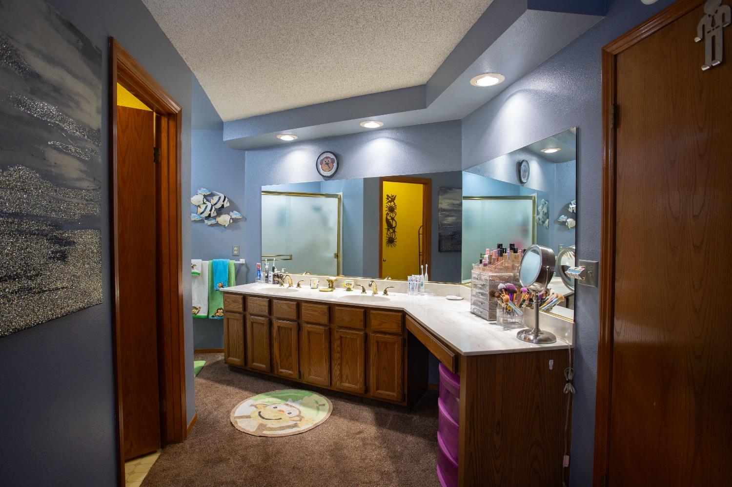 1570 Pine Drive Lemoore, CA 93245 - Photo 15 of 24 a bathroom with a sink double vanity and a mirror