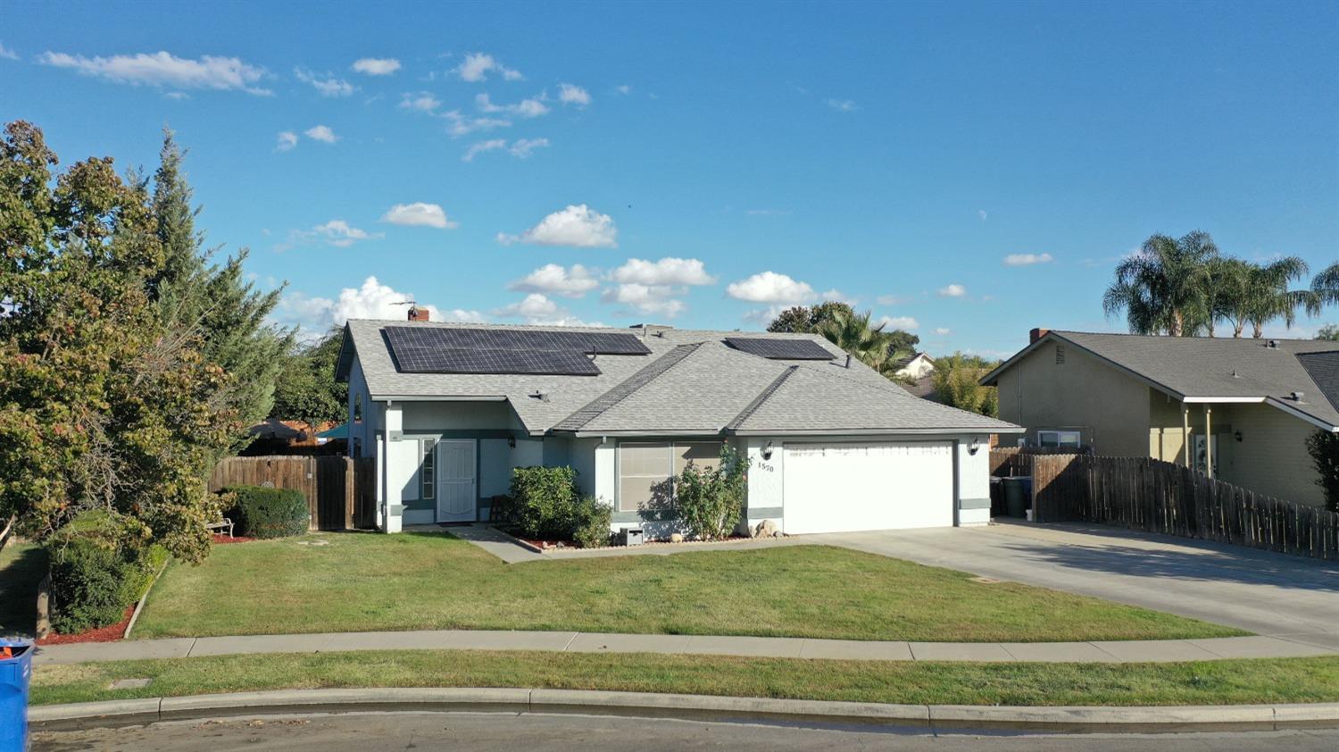 1570 Pine Drive Lemoore, CA 93245 - Photo 2 of 24 a view of a house with a entertaining space