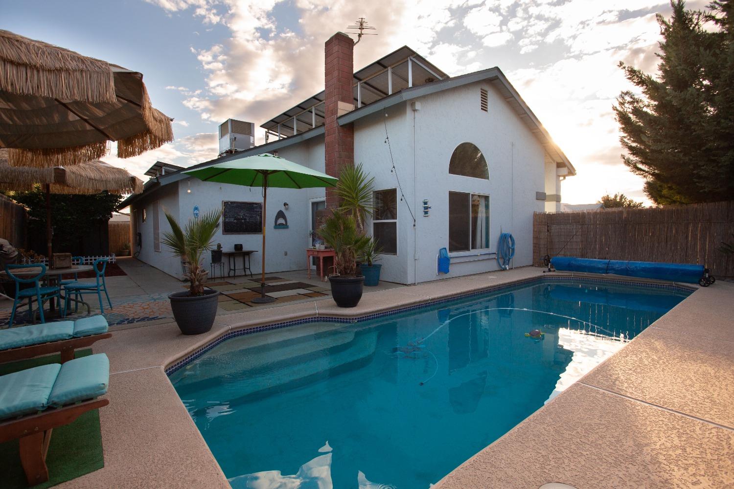 1570 Pine Drive Lemoore, CA 93245 - Photo 21 of 24 a view of a house with a yard