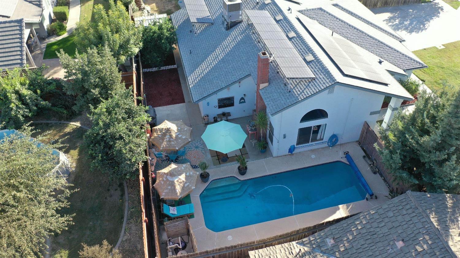 1570 Pine Drive Lemoore, CA 93245 - Photo 22 of 24 a view of a balcony with chairs and potted plants