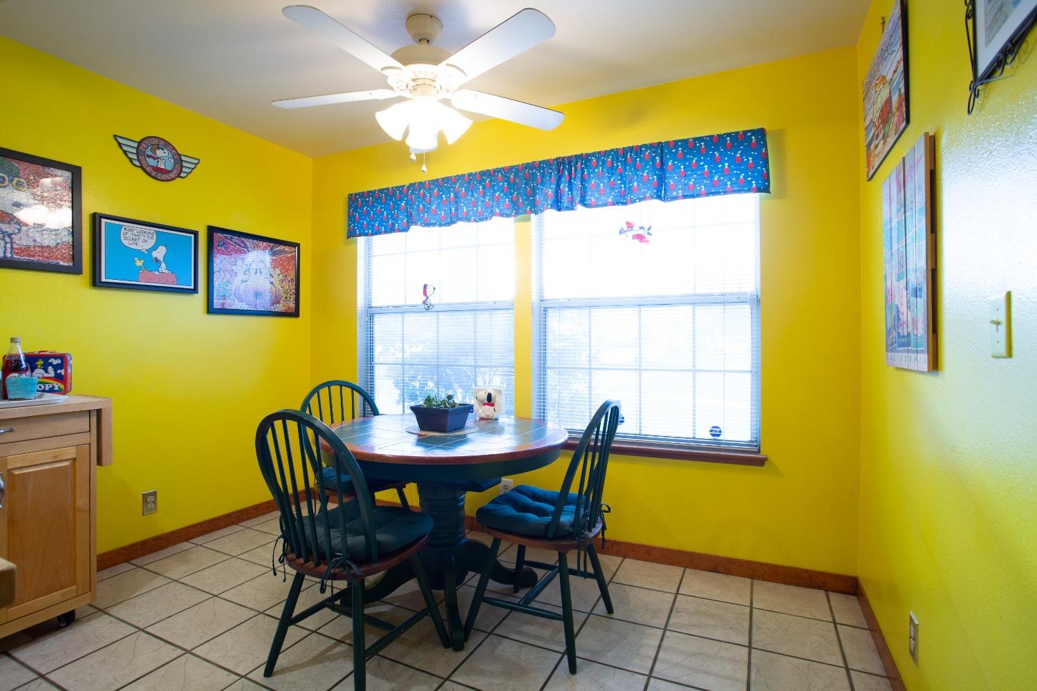 1570 Pine Drive Lemoore, CA 93245 - Photo 9 of 24 a view of a dining room with furniture and a window