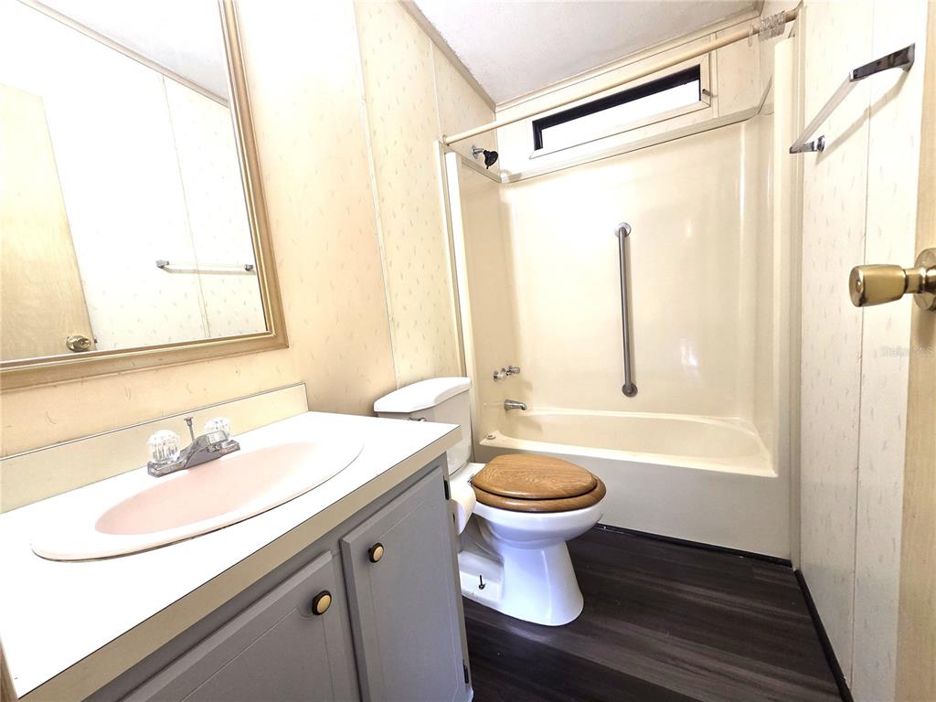 14822 Dilbeck Drive Spring Hill, FL 34610 - Photo 12 of 40 a bathroom with a sink and a bathtub