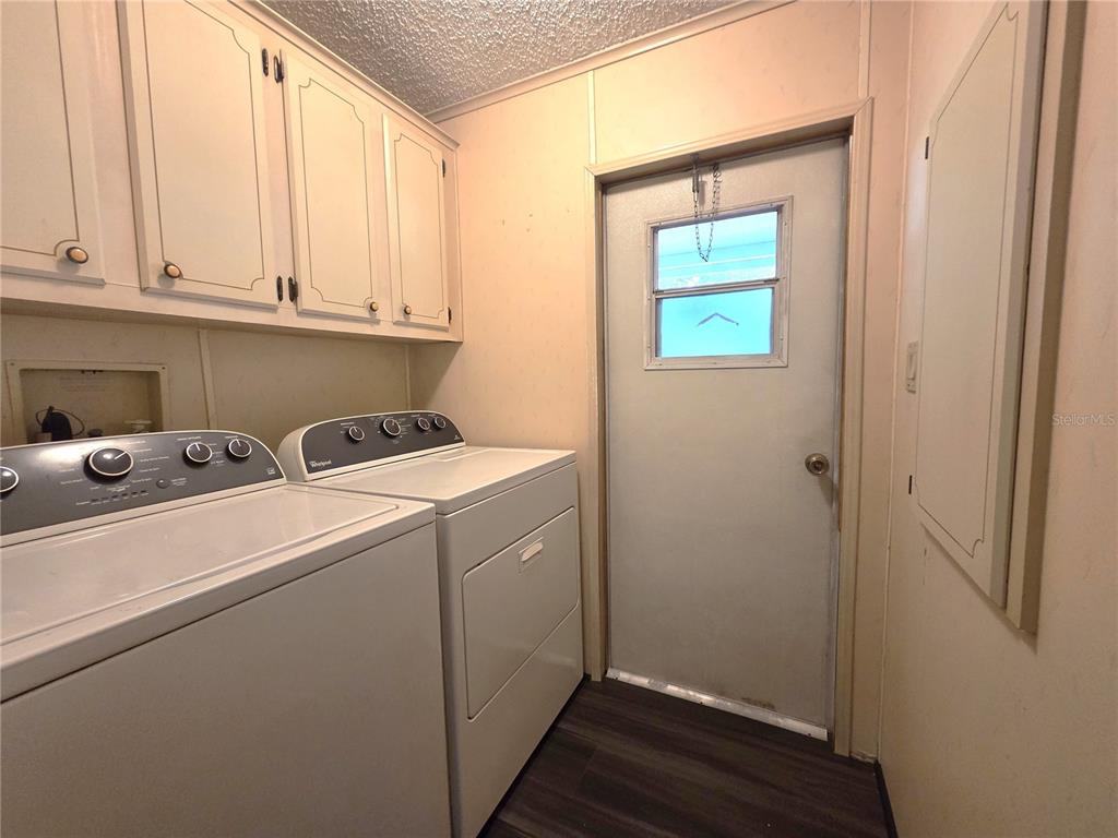 14822 Dilbeck Drive Spring Hill, FL 34610 - Photo 19 of 40 a room with storage and utility