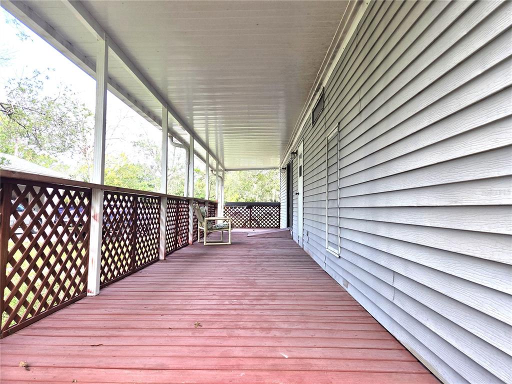 14822 Dilbeck Drive Spring Hill, FL 34610 - Photo 21 of 40 a view of a balcony with wooden floor