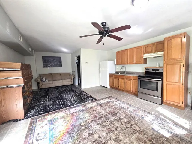 a kitchen with refrigerator cabinets and outdoor