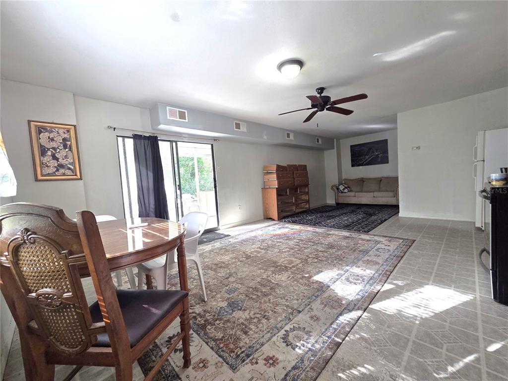14822 Dilbeck Drive Spring Hill, FL 34610 - Photo 25 of 40 a view of a livingroom with furniture and a ceiling fan