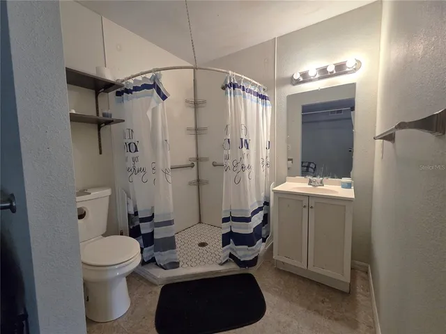 a view of house with backyard