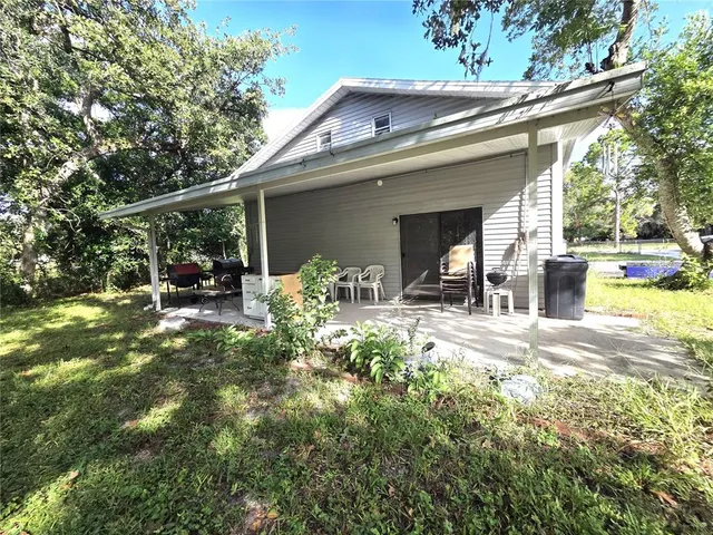 a view of a house with a back yard