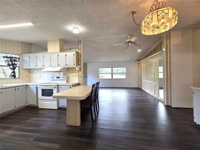 a kitchen with a table and chairs in it