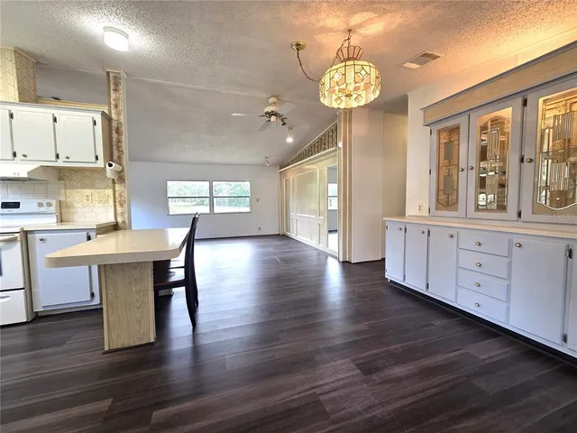a view of a kitchen with breakfast area