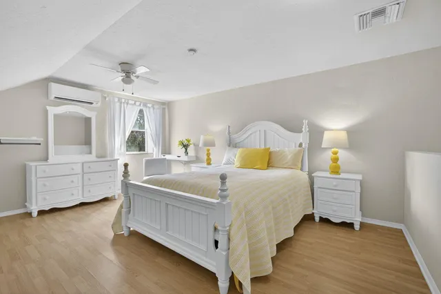 a bedroom with a bed and a dresser