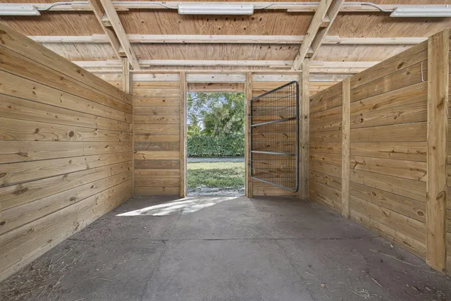 a view of walk in closet with clothes