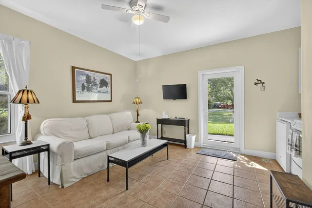 a living room with furniture and a window