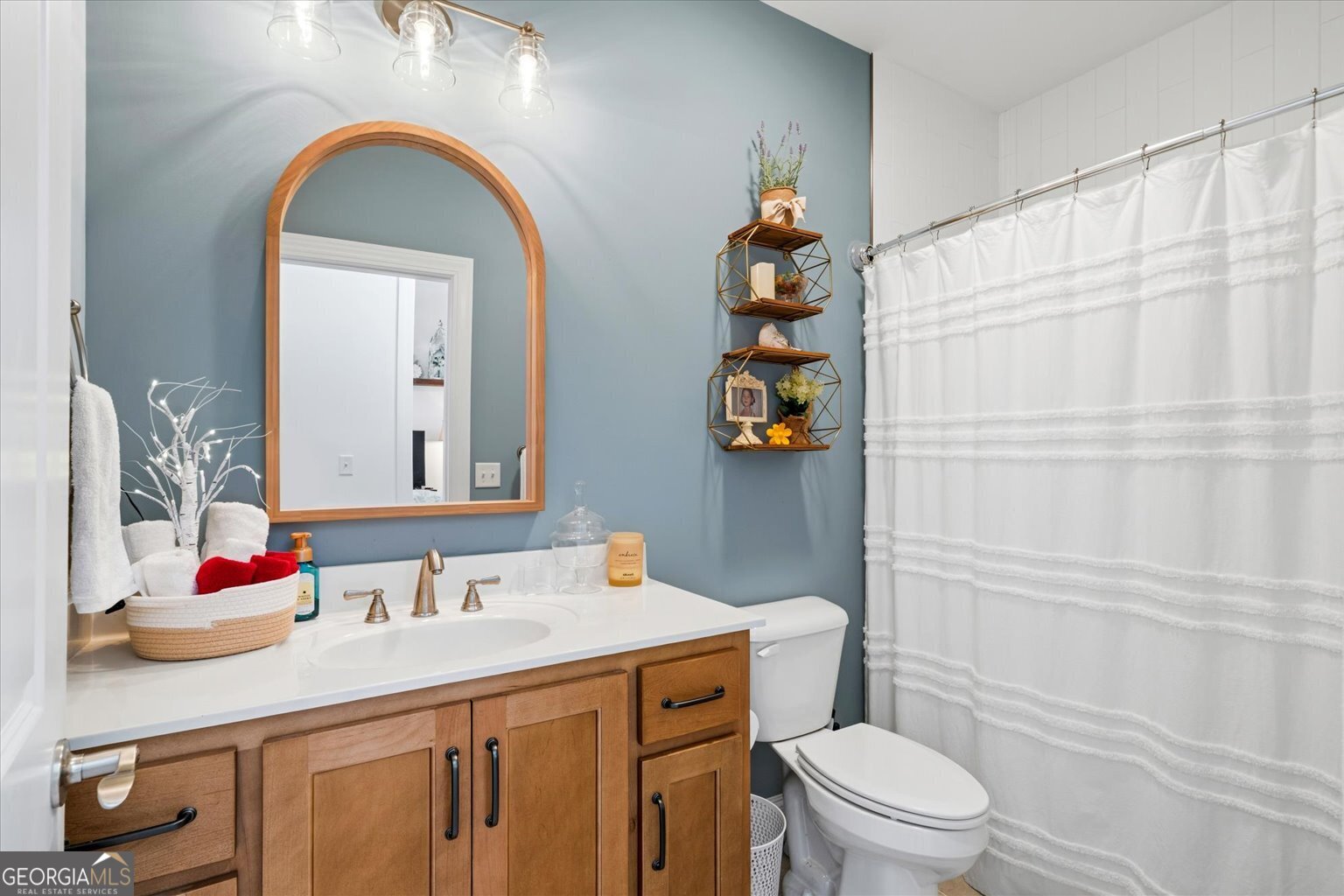 383 Pacer Lane, Unit 3 Dalton, GA 30721 - Photo 38 of 50 a bathroom with a sink a toilet and shower curtain