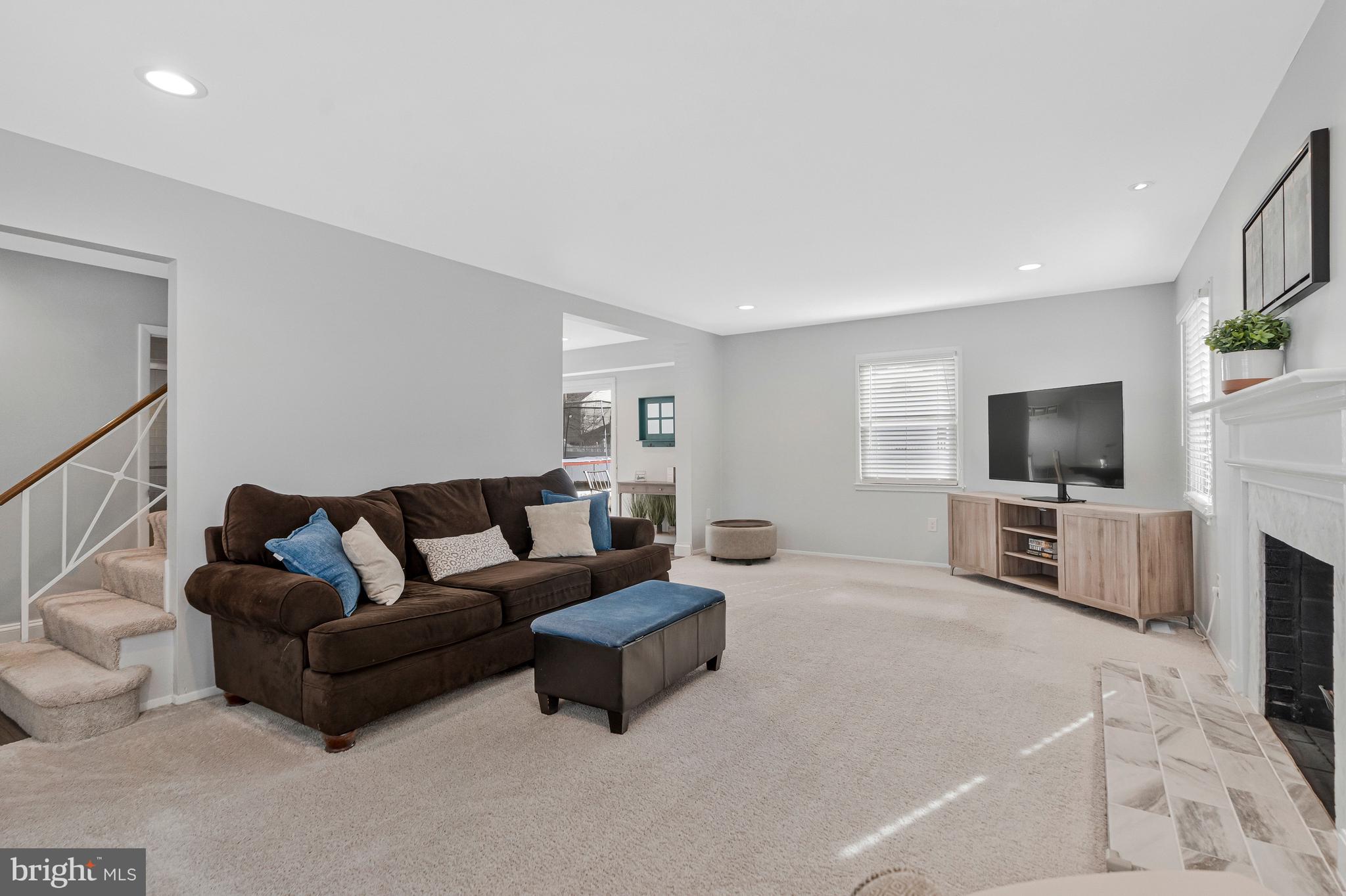 13127 Parson Lane Fairfax, VA 22033 - Photo 11 of 44 a living room with furniture a flat screen tv and a flat screen tv
