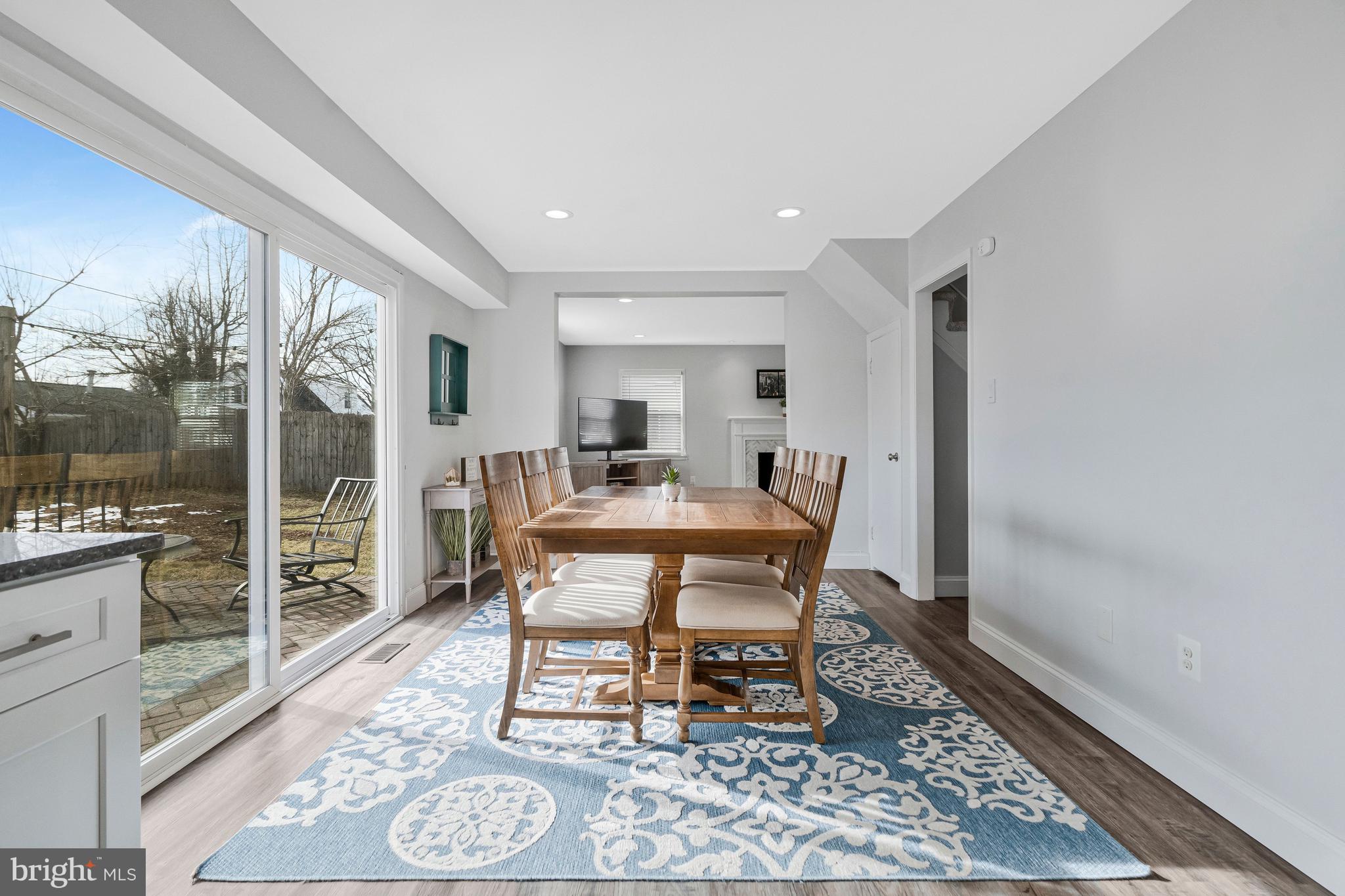 13127 Parson Lane Fairfax, VA 22033 - Photo 15 of 44 a view of a dining room with furniture window and wooden floor