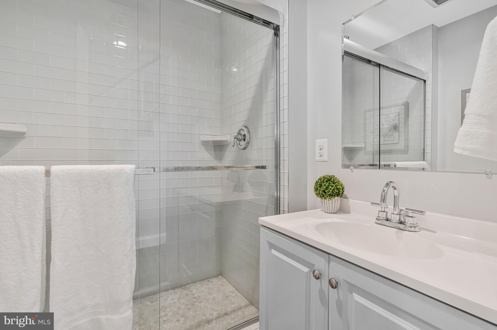 13127 Parson Lane Fairfax, VA 22033 - Photo 22 of 44 a bathroom with a sink and a mirror