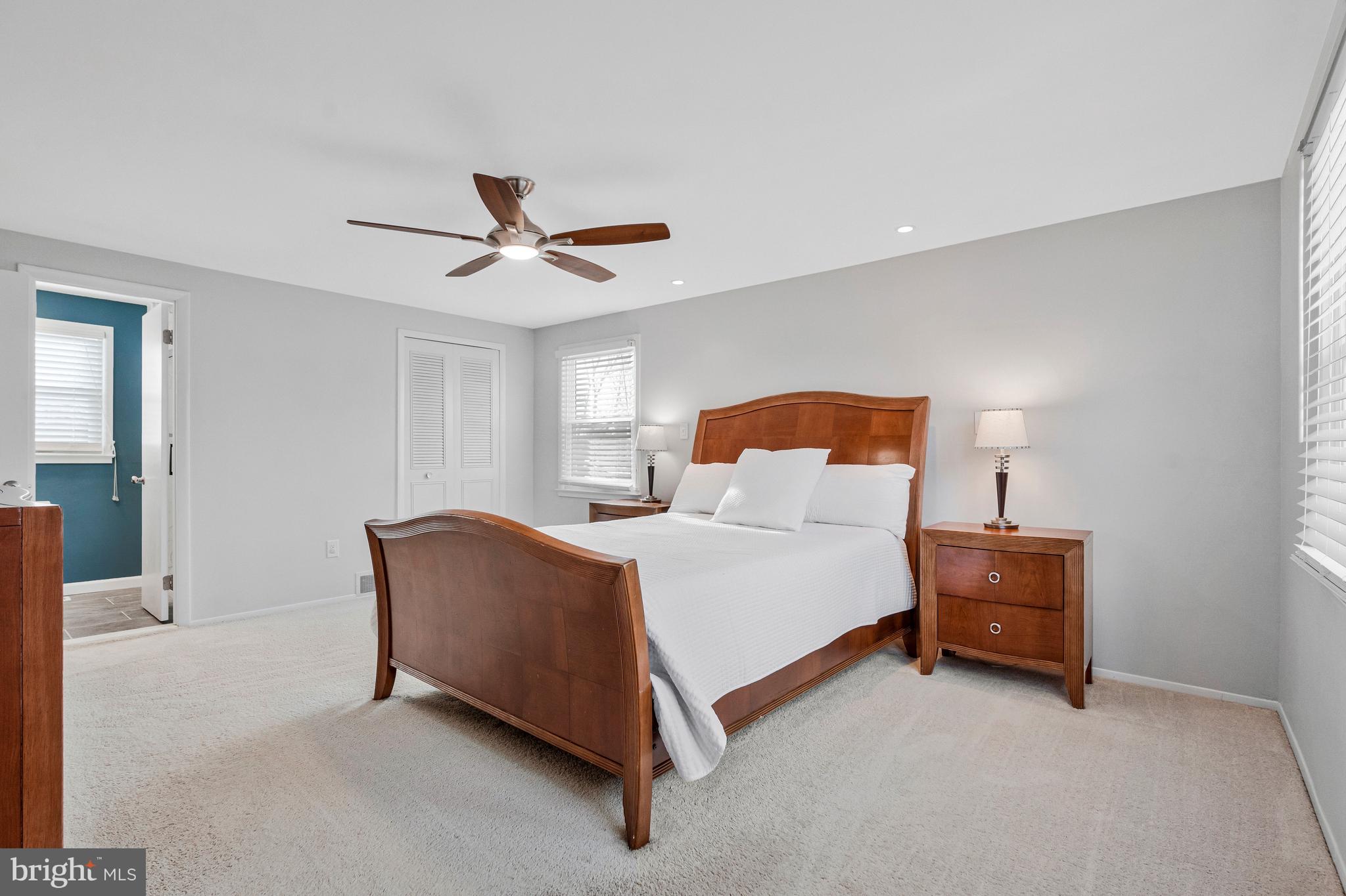 13127 Parson Lane Fairfax, VA 22033 - Photo 26 of 44 a bedroom with a bed and a ceiling fan
